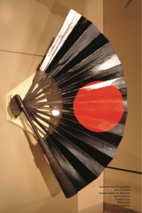 A Japanese war fan of iron and bamboo, painted with a red sun.